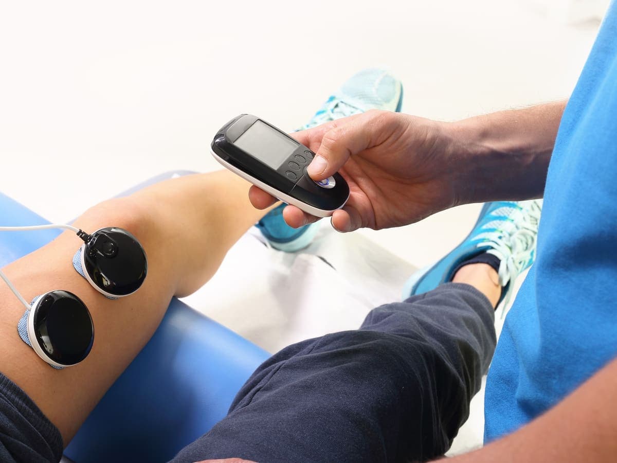 An athlete receiving treatment on the knee